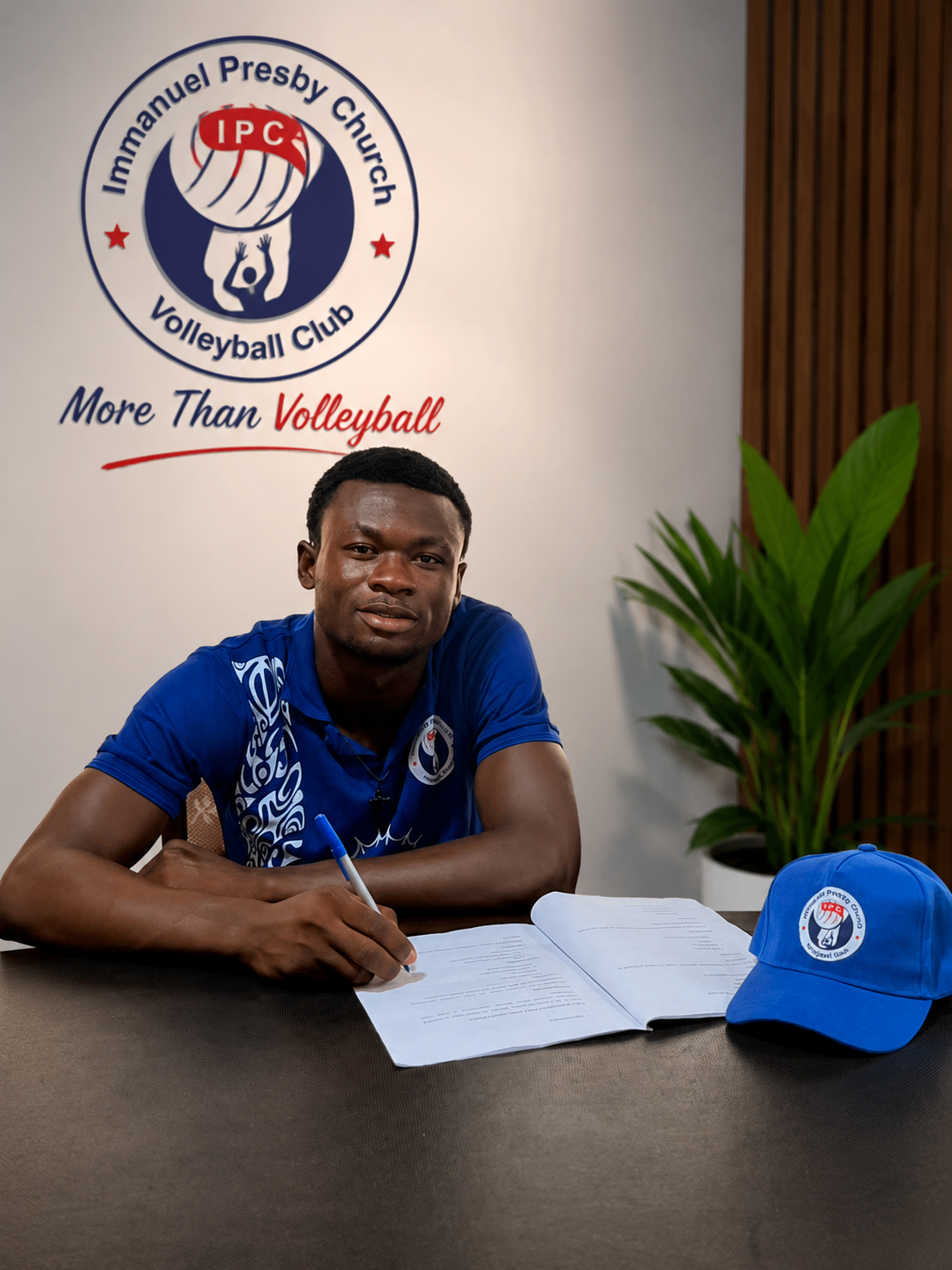Stephen Wiafe Okyere at the IPC Volleyball Club signing table